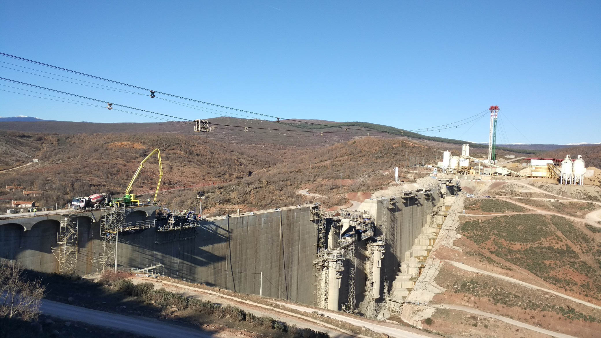 View of cable cranes and dam under construction